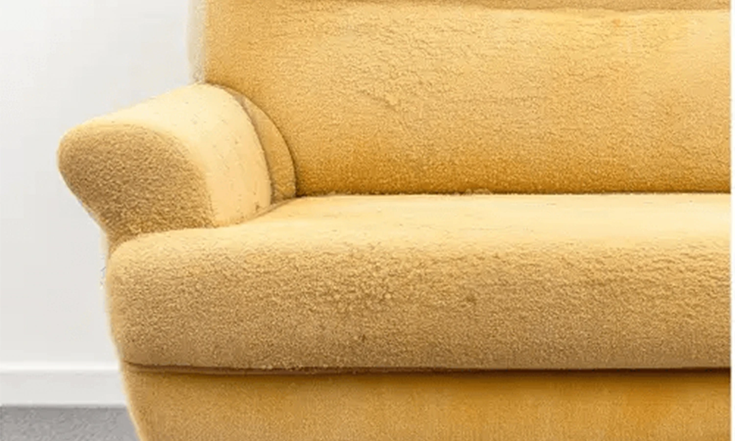 After-1 Detail shot of a yellow armchair inspection before professional cleaning.